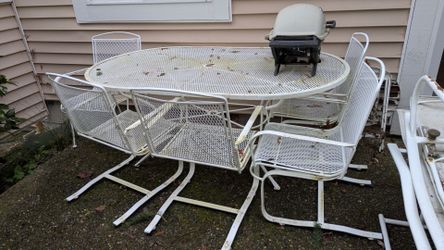 White, wrought iron patio table and chairs