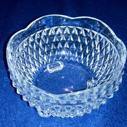 Vintage Indiana Glass Diamond Point Clear pattern clear glass crystal three footed candy or nut dish with a scalloped rim

