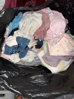 Bag full of baby girl clothes