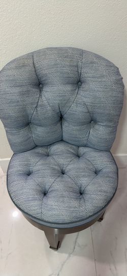Tufted blue vanity chair.