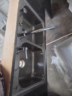 Double sink with slab of countertop