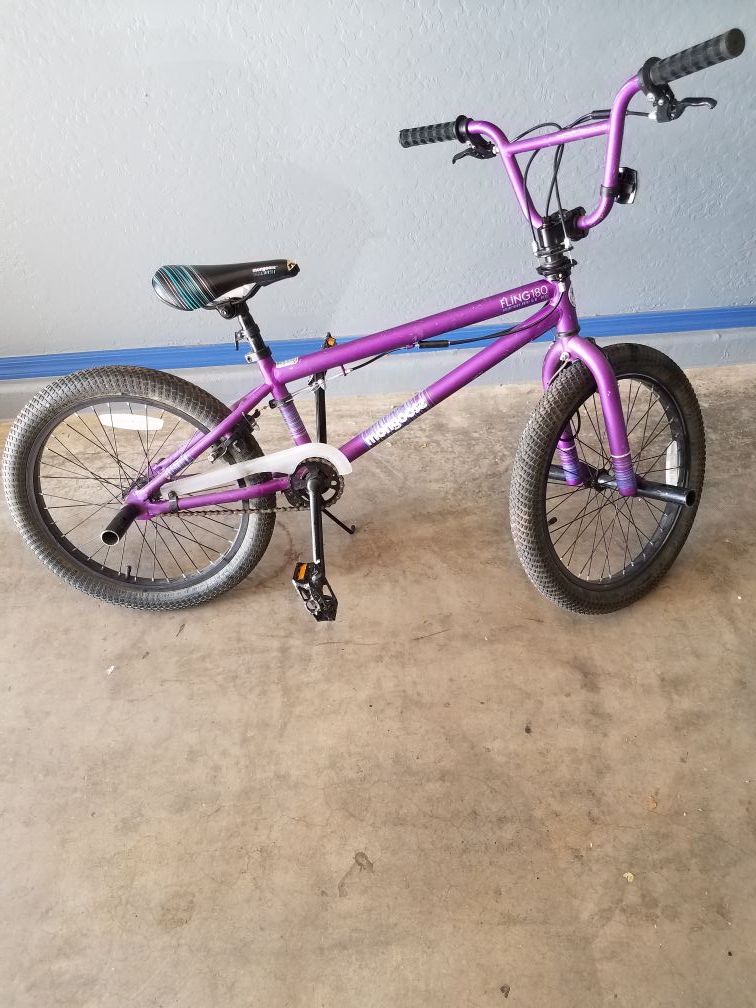 Mongoose Fling 180 girls 20" purple bike with pegs