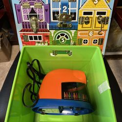 Crayon Electric Sharpener and Melissa & Doug Latches Board and in a storage bin