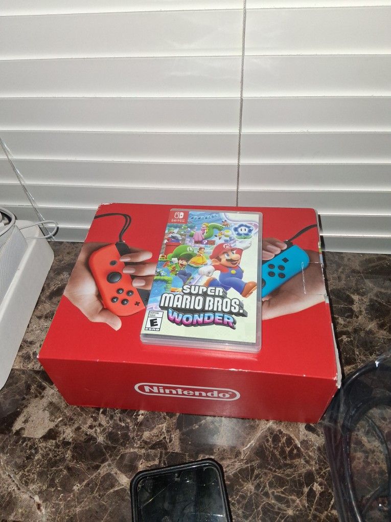 Nintendo Switch Like New & Mario Wonder $180