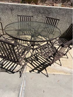 6 Patio chairs with round glass top Table