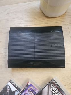 PS3 with games and controller