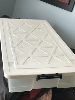 Plastic heavy duty plastic storage box, with wheels lid and laker handles.