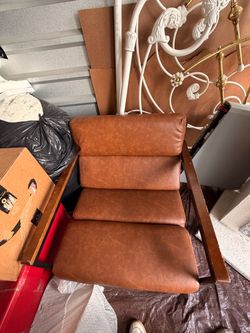 Brown faux leather accent chair