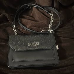GUESS Bowie Debossed Logo Slim Clutch logo-embossed crossbody bag in black faux leather