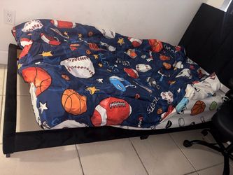 Two twin black bed frames with headboard