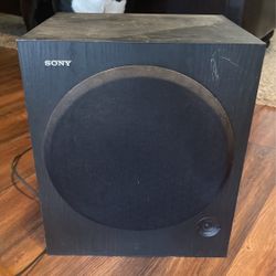 Two Yamaha Tower Speakers, Sony Subwoofer, And Yamaha Receiver