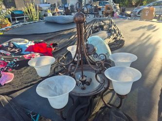 Mediterranean-style 5-light scroll arm chandelier.