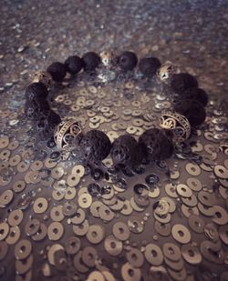 ** Men’s Lava stone & Silver plated metal filigree bracelet.