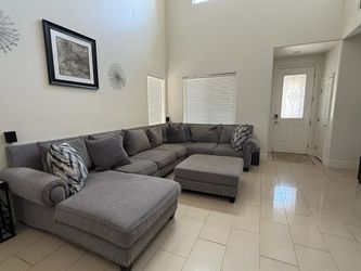 Sectional couch grey with ottoman