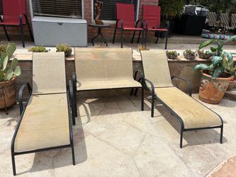 Chaise lounge chairs and a love seat patio chair