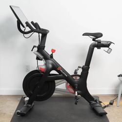 Peloton W/ Riding Shoes And Hand Weights