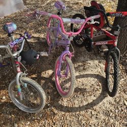 1 Boys Bike, 2 Girls Bike 2 Helmets And 2 Scooters