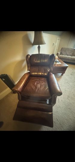 2 brown leather recliners