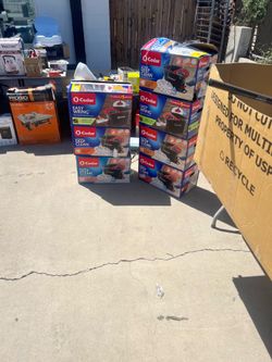 Yard Sale: Everything in the boxes is $50c , $2, or $5. O-Cedar Mop: $25