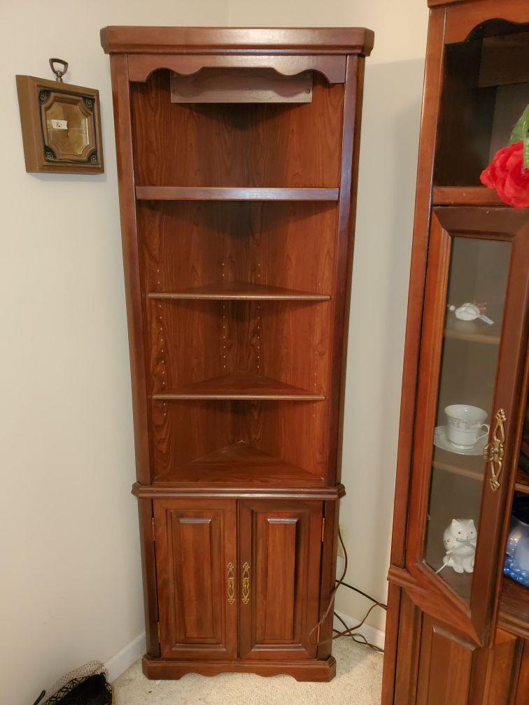 Pair of lighted corner curio cabinets..REDUCED