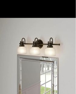 Progress Lighting Archie 3-Light Bath Vanity Light (Model P2992-74) in a Venetian Bronze finish.