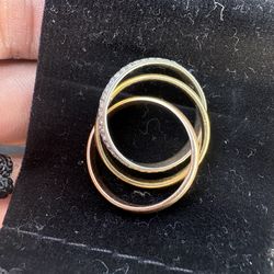 Three gold tone 18k ring with diamonds