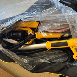 Drywall sander w vacuum bag and pads.
