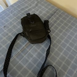 Compact black shoulder bag.