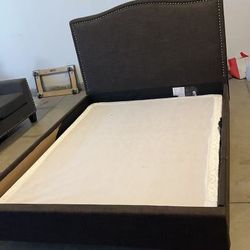 A very sturdy queen bed, already disassembled and stored in the garage.