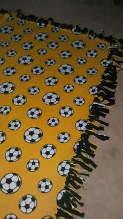 Large thick blanket* soccer themed* ties on the side
