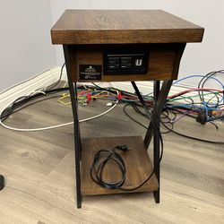 End table with electric outlet access. 