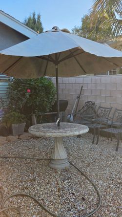 Concrete patio table with umbrella