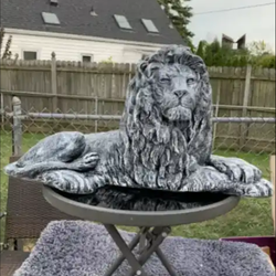 Stone colored lion statue