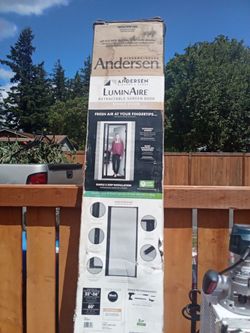black Andersen LuminAire retractable screen door.