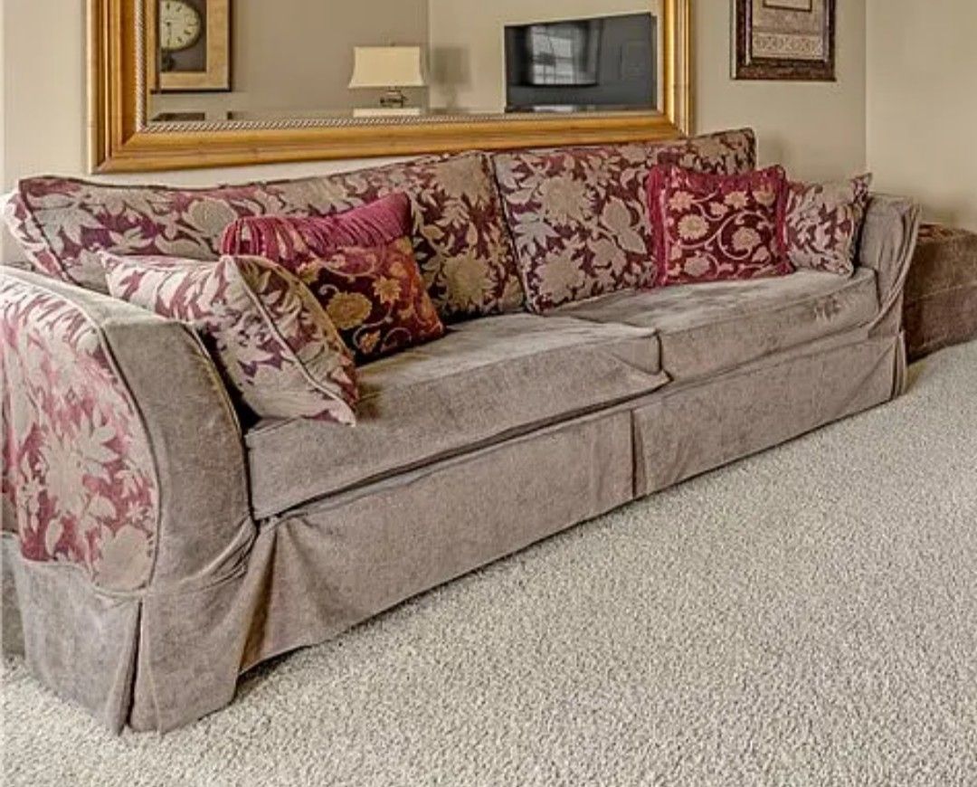 Sofa, loveseat, and two small ottomans, all custom slipcovered. 4 pieces. Wine & brownish green.