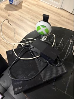 Xbox one console and holder for headphones