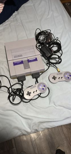 Súper Nintendo console with cable power cord, rf and 2 controllers tested