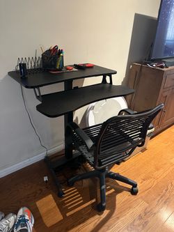 Standing desk and rolling chair