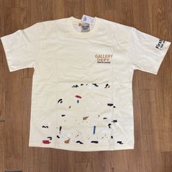 Gallery Dept. cream T-shirt with multicolour paint-style design. Size L. Made in USA. Good pre-owned condition with no major flaws.