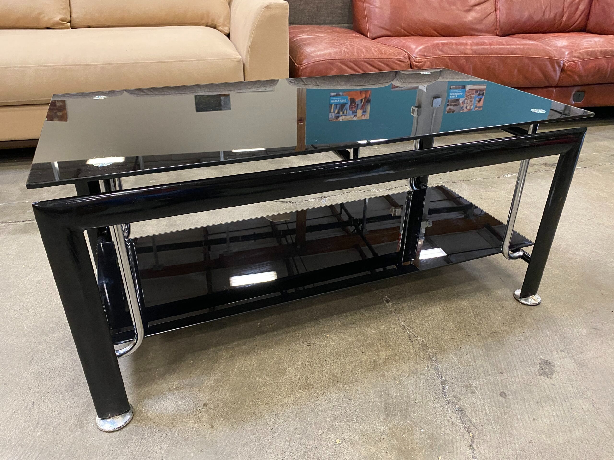 2 Tiered Black Glass Coffee Table with Curved Silver Accents
