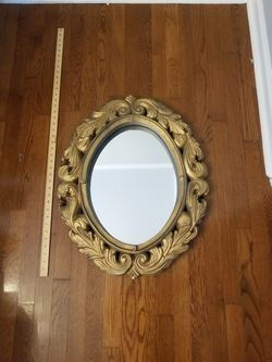Antique mirror cracked at the bottom