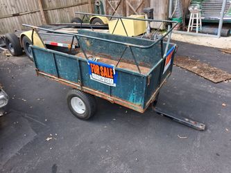 Trailer and seed spreader