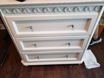 3 white Dressers