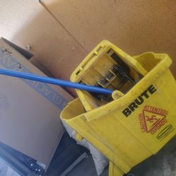 Brute yellow industrial mop bucket with brand new stick