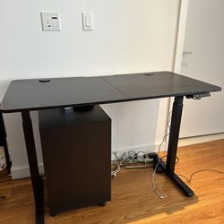 Black electric standing desk with programmable heights