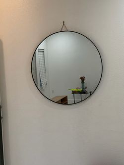 Black rounded mirror
