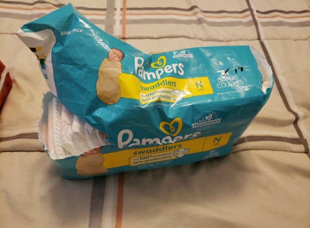 HUGGIES And PAMPERS Both Are  Size NEWBORN