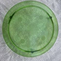 Green Glass Stand With Flowers On It