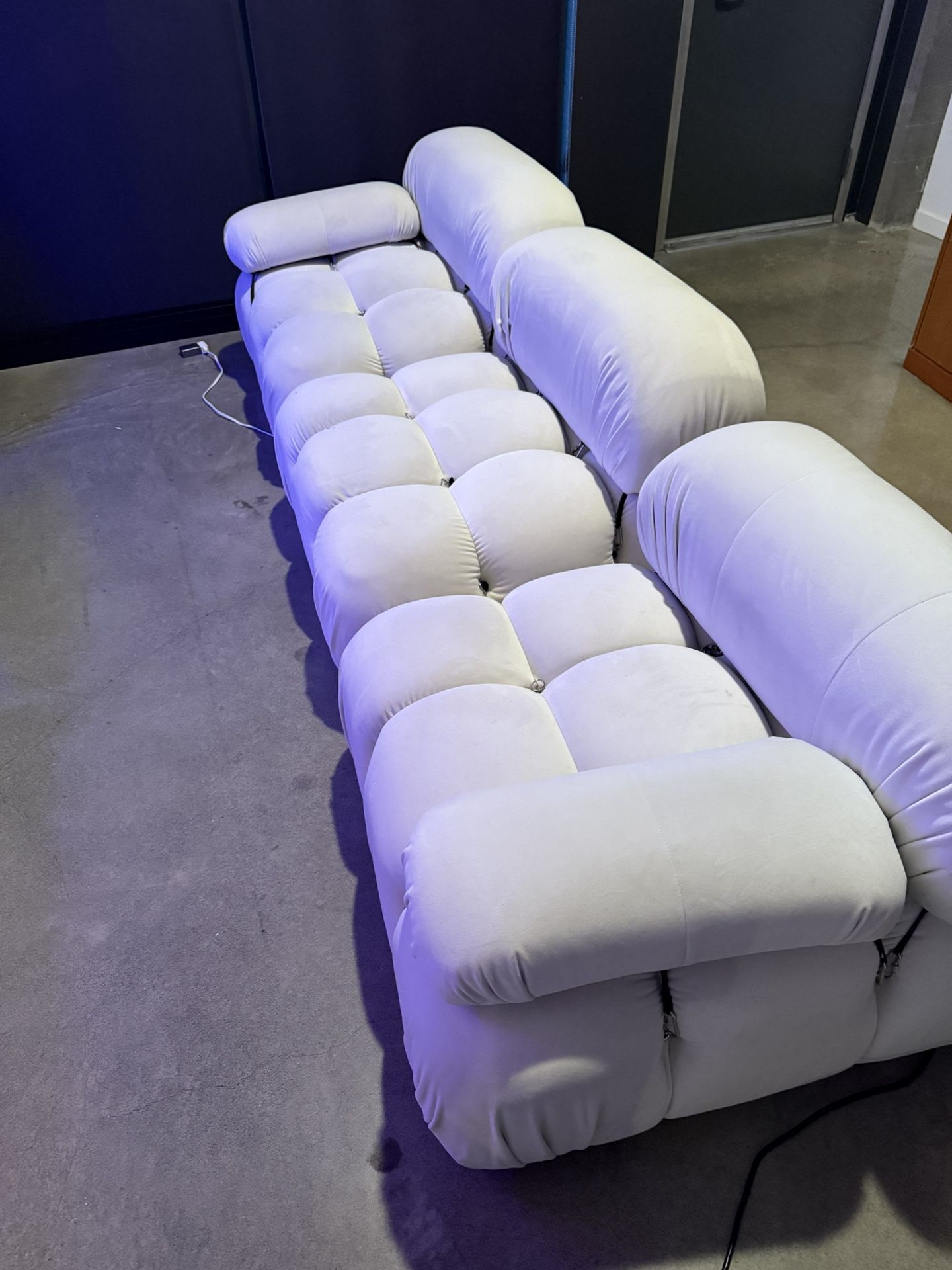 White Belia sectional suede sofa.