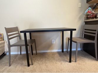 IKEA desk and two chairs